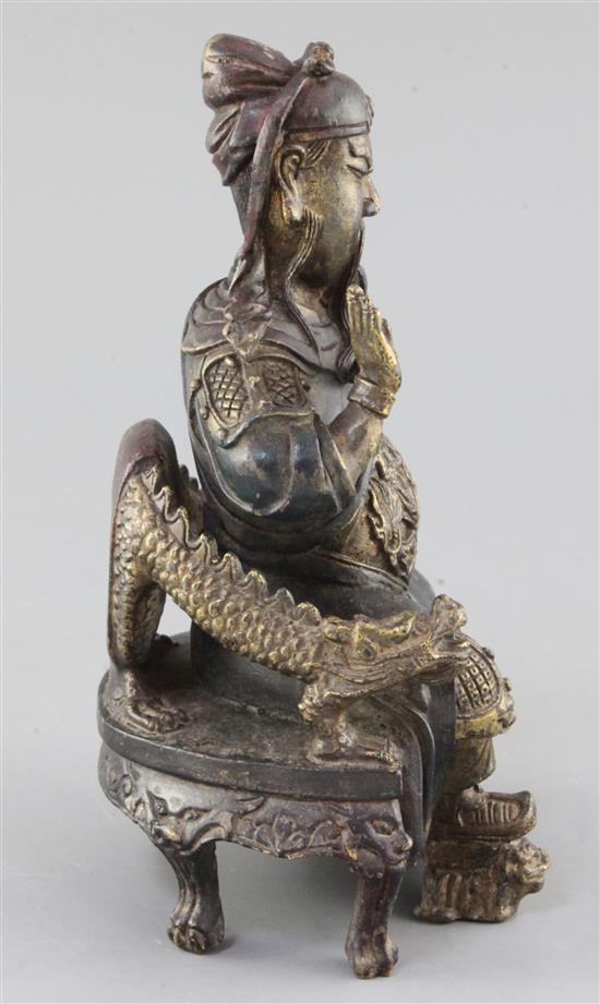 A Chinese polychrome decorated bronze seated figure of Guandi, probably Ming dynasty, height 21.5cm
